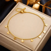 Gold butterfly charm anklet.